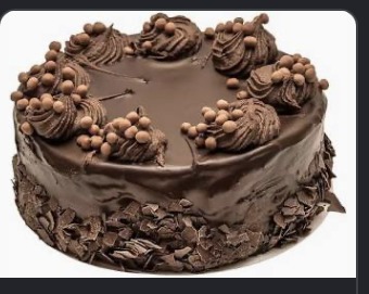 Close-up of chocolate ganache drip on a cake